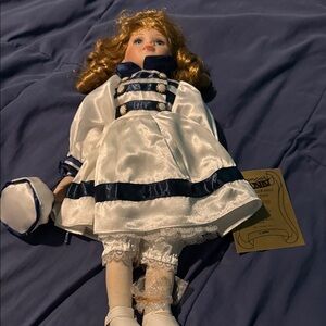 Elegant Porcelain Doll with White and Blue Dress